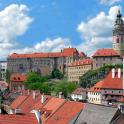 a view of a city with buildings and roofs