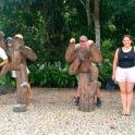 a group of people standing next to a group of bear statues