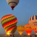 a group of hot air balloons flying in the sky