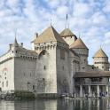 a large castle sitting in the middle of the water