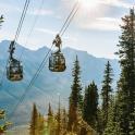 two gondolas on a ski lift in the mountains