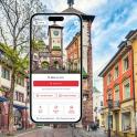 mobilní telefon před budovou s hodinovou věží