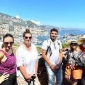a group of people posing for a picture on a mountain