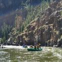 a group of people in a raft on a river