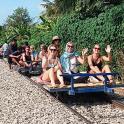 a group of people sitting on the back of a train