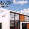 a building with the words the devils concrete museum