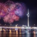 a fireworks display with the space needle in the background