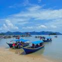 a group of boats sitting on the beach