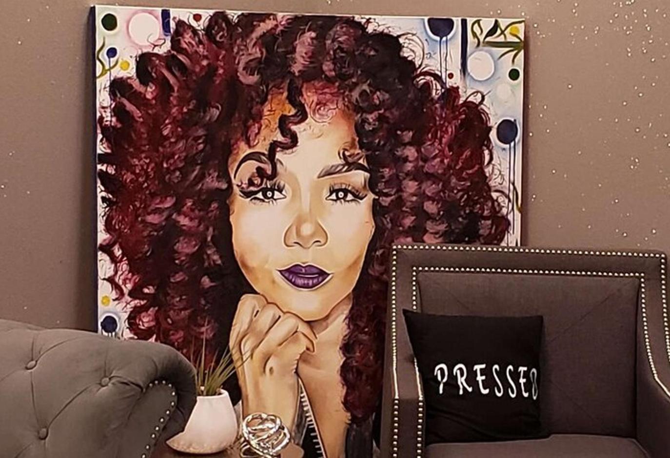 a large painting of a woman with her hair