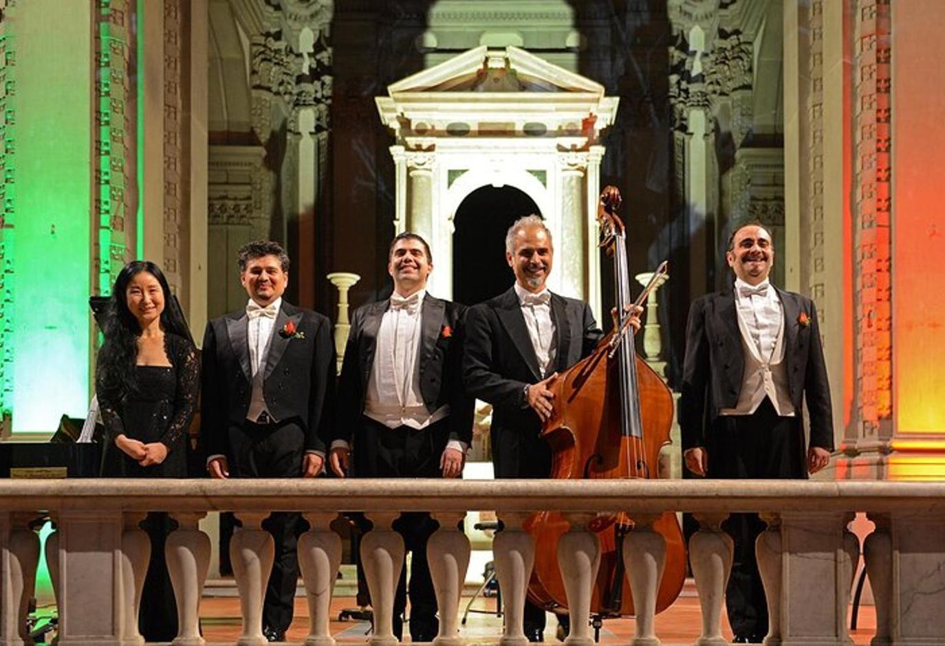 a group of people posing for a picture with aviolin