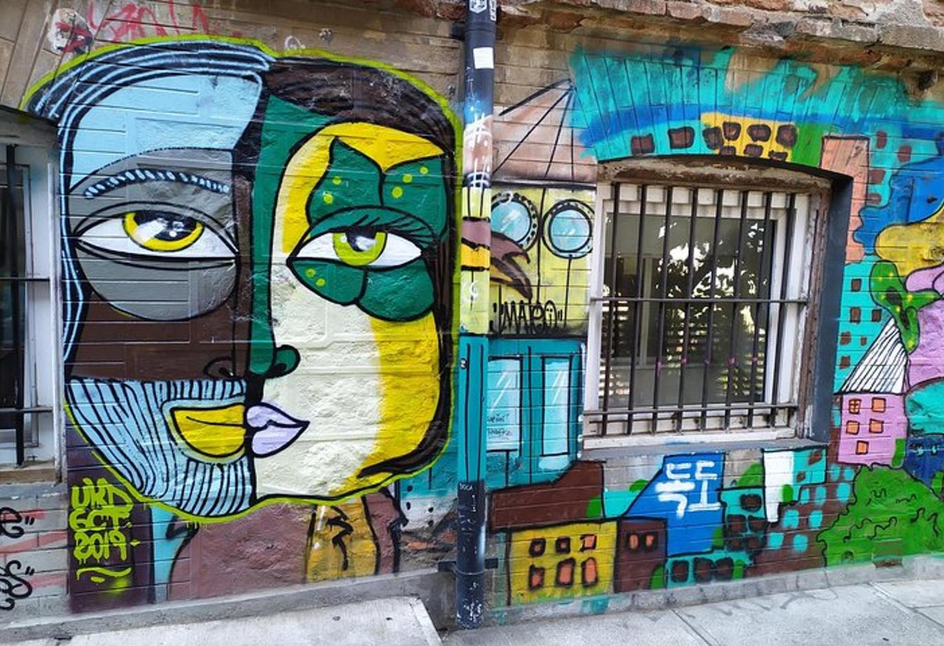 a painting of a woman on the side of a building