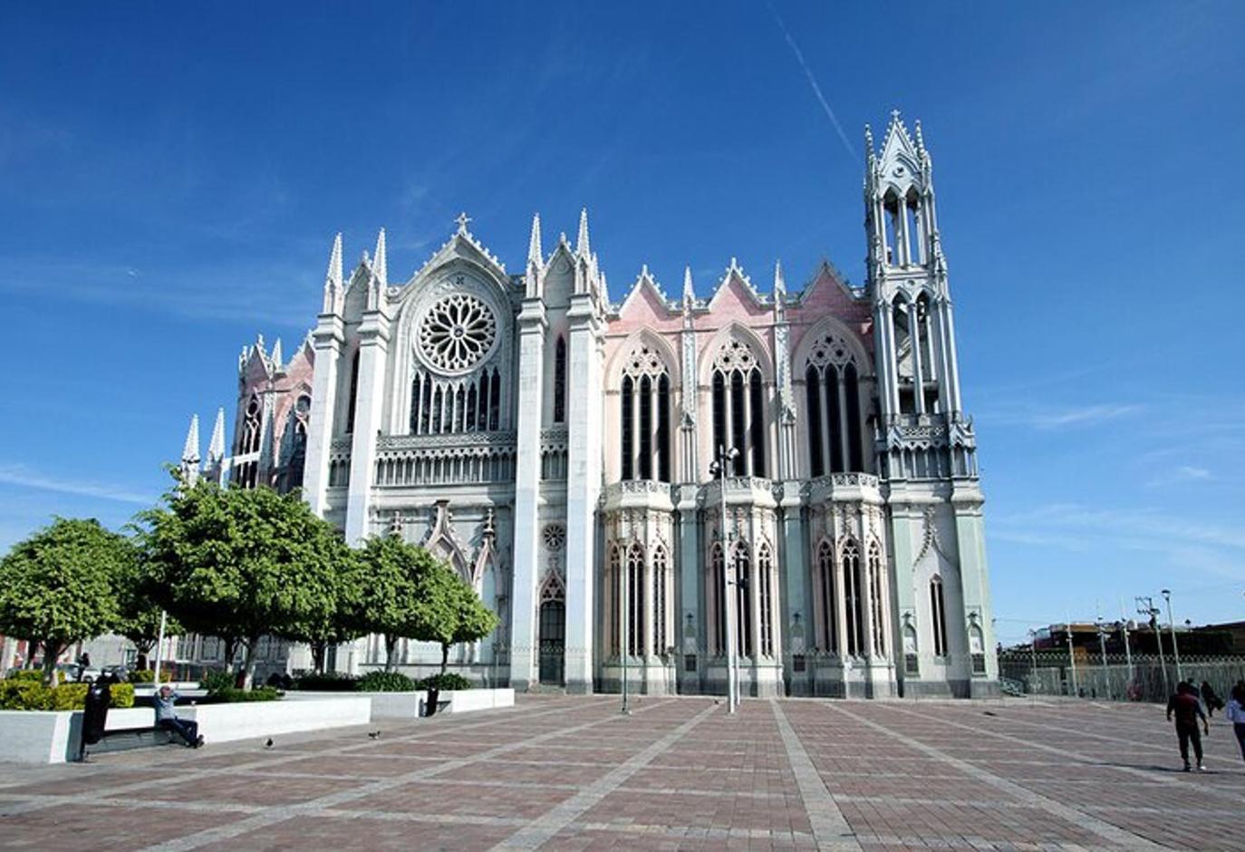 a large cathedral with a clock on the front of it