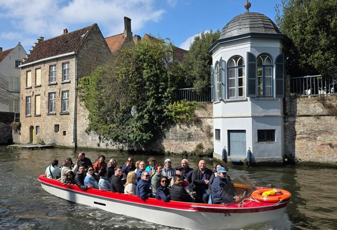 a group of people on a boat in the water
