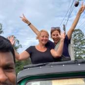a group of people riding in the back of a truck