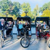 a group of people riding in a t pulled carriage