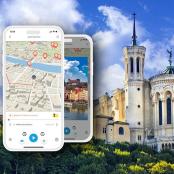 two cell phones next to a building with a map