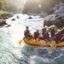 a group of people in a raft on a river