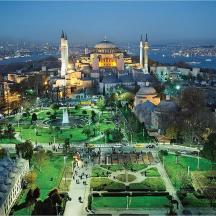 a view of a city with a mosque at night