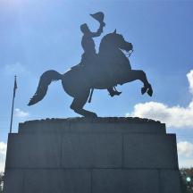 a statue of a man riding a horse