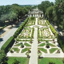 an aerial view of a garden in front of a building