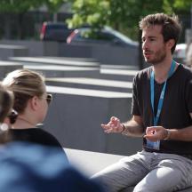 a man talking to a group of people