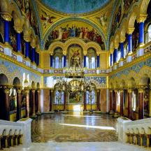 a large room with paintings on the ceilings of a building