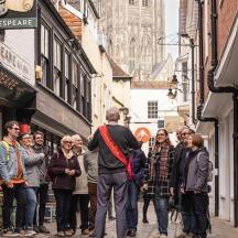 a group of people walking down a street