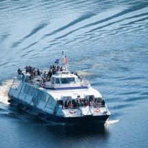 a boat with a group of people on it in the water