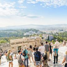 a group of people standing on the top of a building