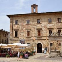 an old building with an umbrella in front of it