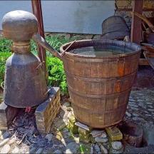 a wooden bucket sitting on top of a fire place