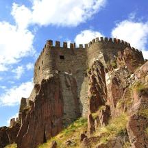 a castle on the side of a mountain