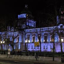 a building lit up in blue at night