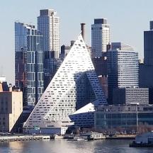 a view of a city with a pyramid shaped building