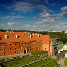 a large brick building with a clock tower in a city