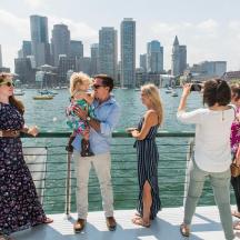 a group of people standing on a boat