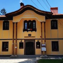 a large yellow building with a large window