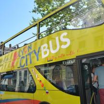 a yellow double decker bus parked on the street
