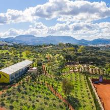 an aerial view of a farm with a bus