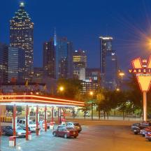 a parking lot with a katz gas station in a city