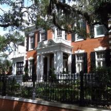 a house with a fence in front of it