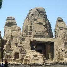 a group of people standing in front of a temple