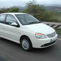 a white car is driving down a highway