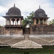 a building with two domes on top of a wall