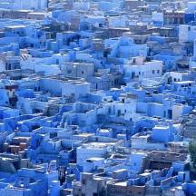 an aerial view of a blue city