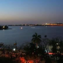 an island in a large body of water at night