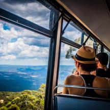 a group of people sitting on a bus looking out the window