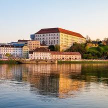 a group of buildings next to a body of water