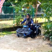 a man riding a four wheeler in the water