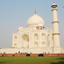 a large white building with two tall domes
